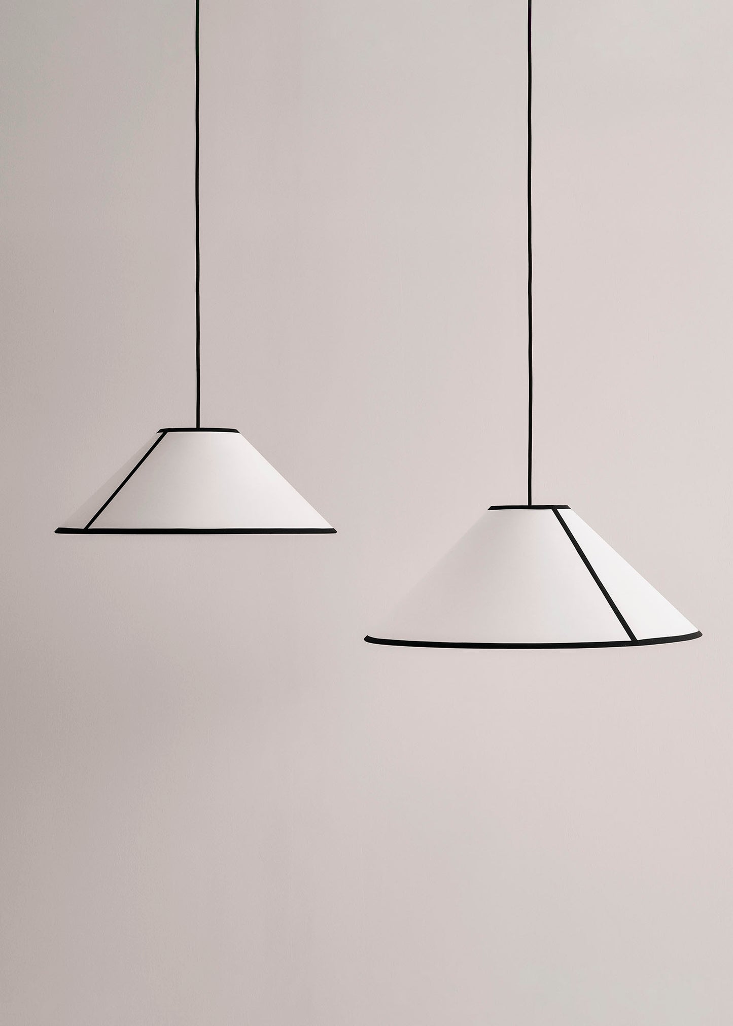 Two Ava Cone Pendants hanging against a plain background